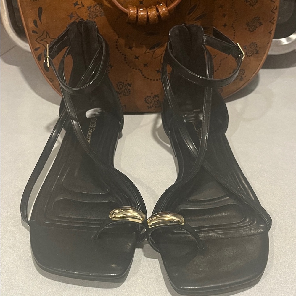 BCBGeneration Black and Gold Strappy Sandals
